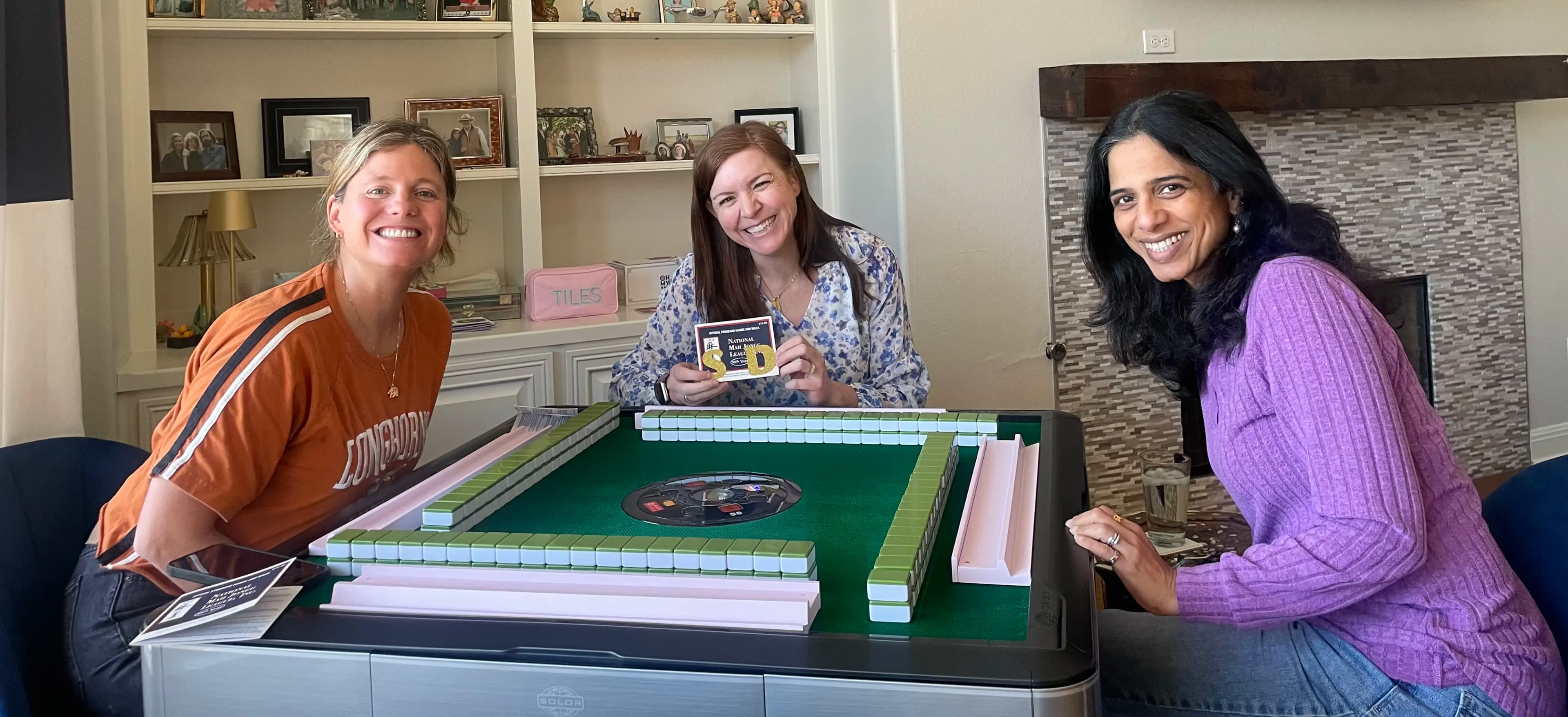 Sara teaching American Mahjong with friends at the table